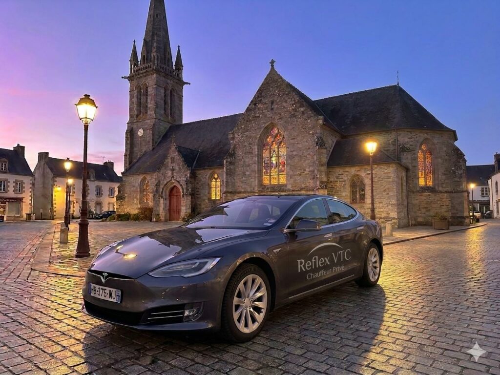 Chauffeur privé Reflex VTC à Saint-Avé en Tesla Model S devant l'église, service de transfert gares et aéroports dans le Morbihan.